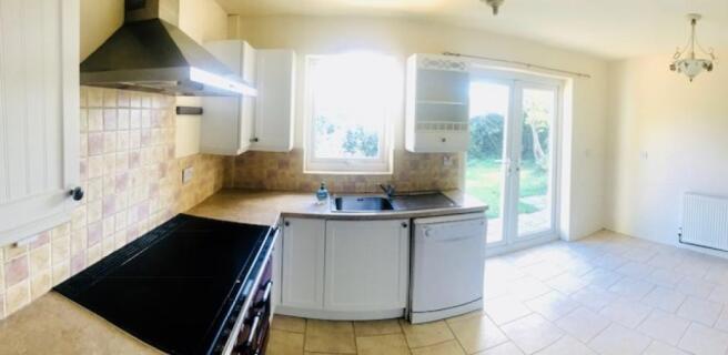 Fully fitted kitchen/dinner leading out onto garde