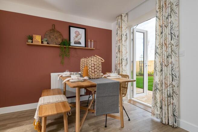 An open plan kitchen dining area is designed for sociable living