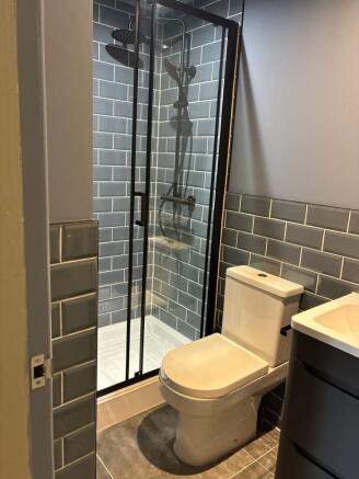 Stylish modern bathroom with rainfall shower...