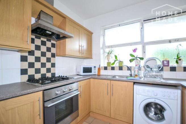 Bright kitchen with fitted units and appliances...