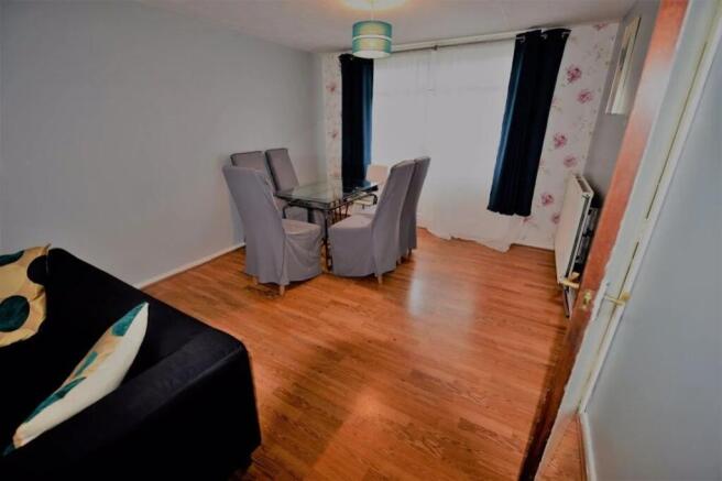 Bright living/dining room with wood-effect floo...