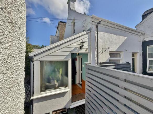 Sun room entrance from the lane