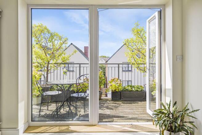 VIEW OF BALCONY VIA LIVING ROOM