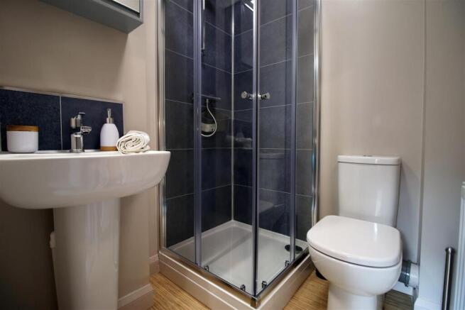 Modern bathroom with stylish blue tiling...