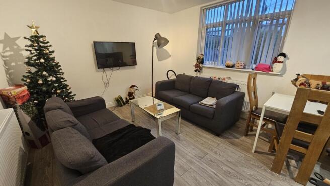 A cozy and well-maintained living room featurin...
