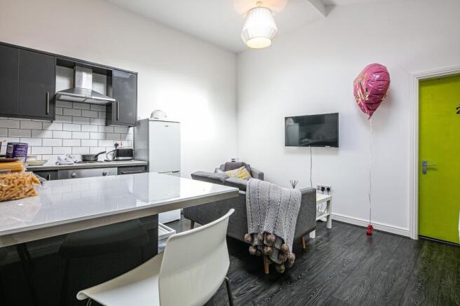 Bright open-plan kitchen and lounge with modern...