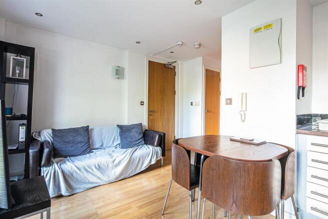 Bright lounge with dining area and wooden floor...