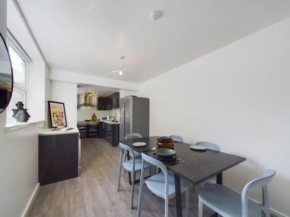 Bright modern kitchen-diner with a sleek dining...