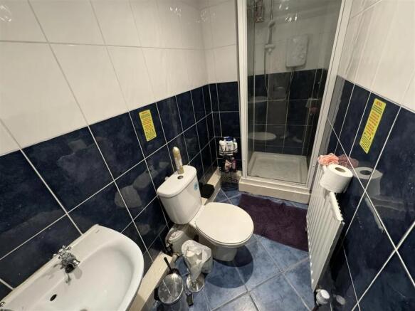 Functional bathroom with private walk-in shower...
