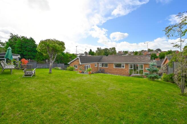 Landscaped gardens and patio areas to rear