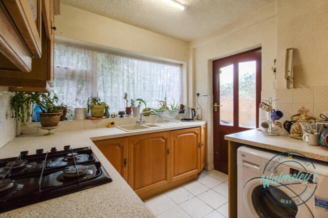 Kitchen with door to gardens