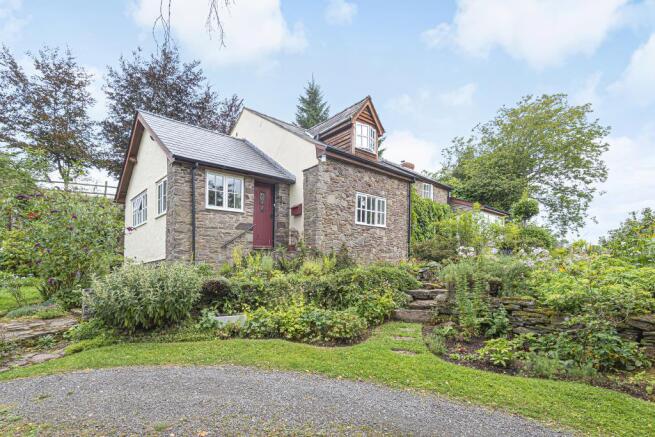 Surrounded by colourful gardens, caringly tended