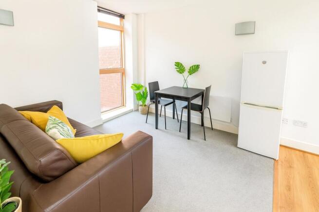 Bright and inviting living room featuring a com...