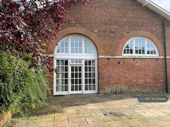Entrance Through Double Height Archway