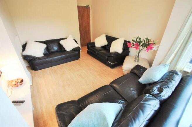 Spacious living room with comfortable sofas...