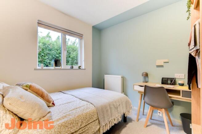 Bright modern bedroom with stylish study desk...
