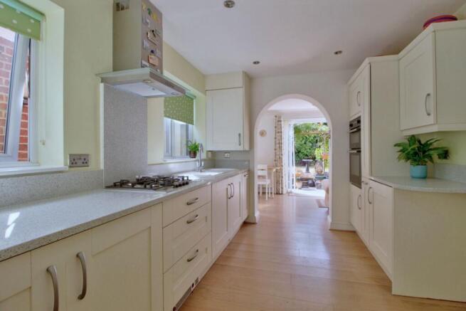 Shaker kitchen leads to sunny breakfast room