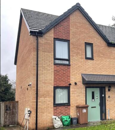Two storey house with pale green door
