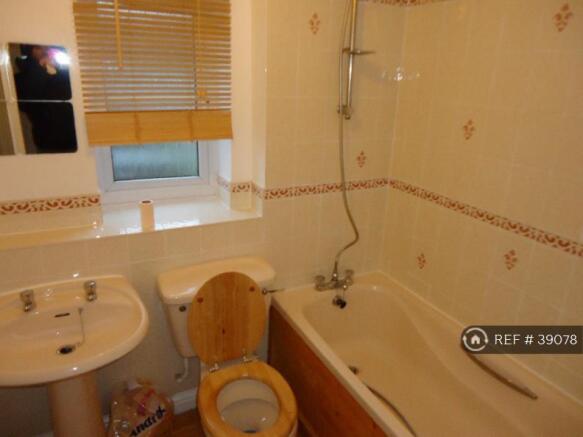 Bathroom With Bath And Mixer Tap Shower Above