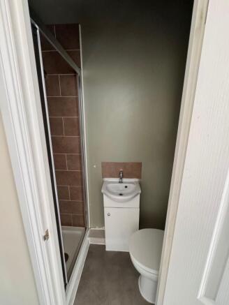 Modern ensuite with sleek vanity and shower...