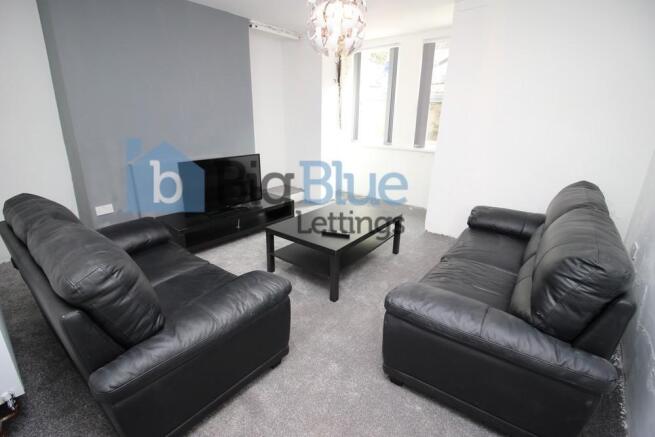 Comfortable and modern living room featuring bl...