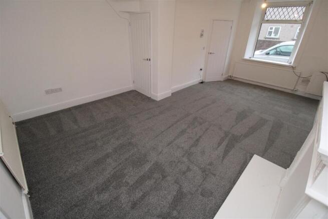 Spacious modern living area with fresh carpets...