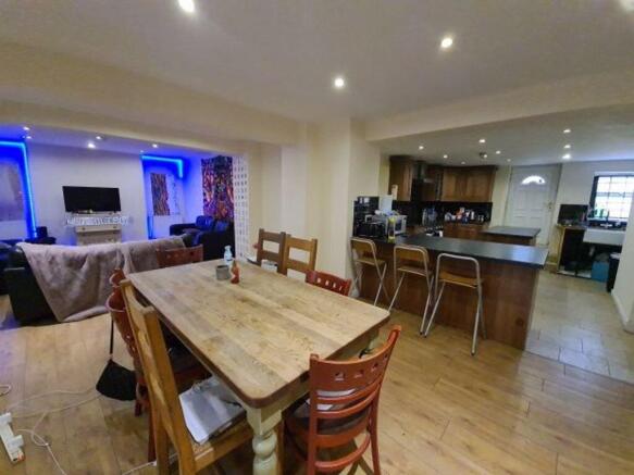 A spacious, contemporary open-plan living and d...