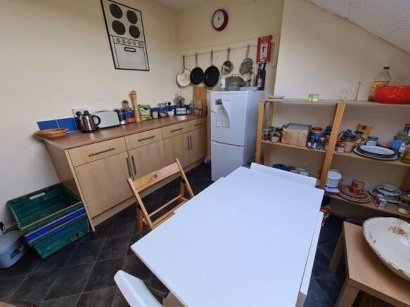 Bright and functional kitchen area featuring am...