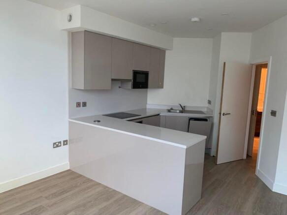 Open-plan kitchen and studio living area at Kings