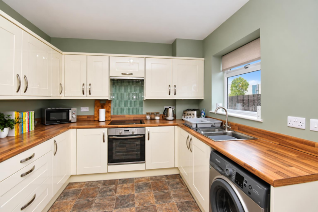 Modern Sage-Green U-Shaped Kitchen.png