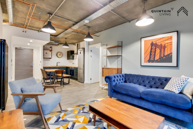 Blue sofa and modern kitchen.png