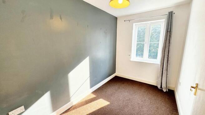 Bright bedroom with modern feature wall...