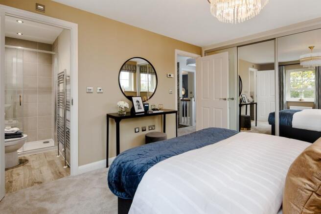 En suite main bedroom in the Alderney Show Home at Coat Grove