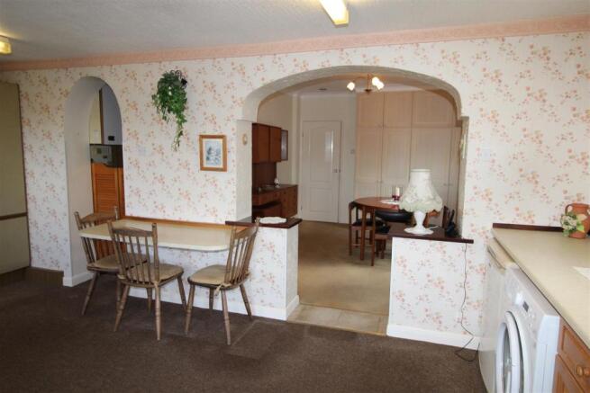 VIEW SHOWING ENTRANCE TO KITCHEN FROM DINING AREA