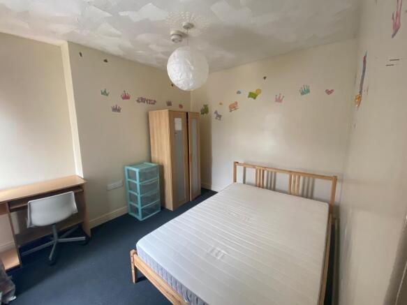 Bright bedroom with double bed and study desk...
