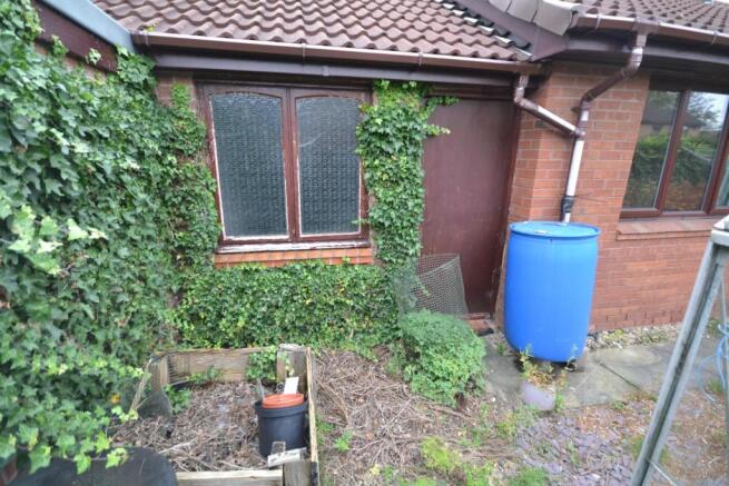 VIEW OF SIDE OF PROPERTY & GARDEN