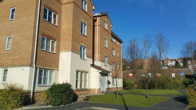 Well-maintained modern apartment block set in t...
