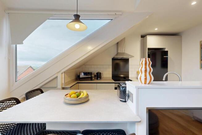 Bright and modern living room with ample natura...