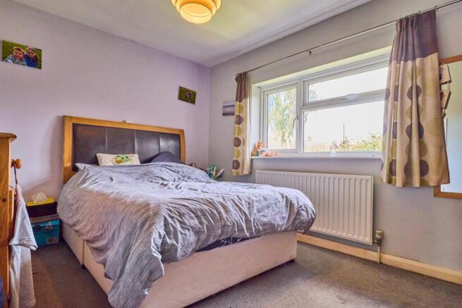 BEDROOM ONE TO REAR