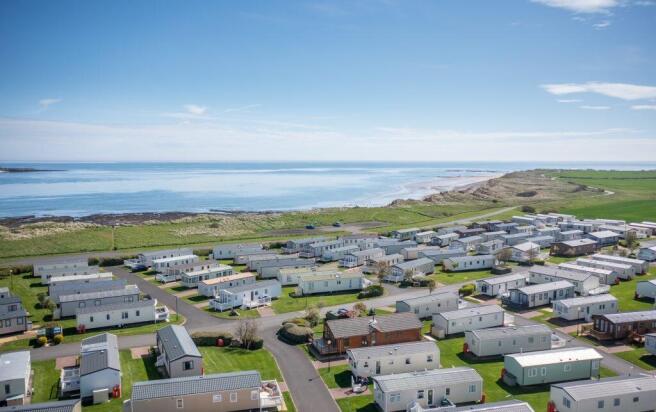 Aerial view of Amble Links Holiday Park beside the