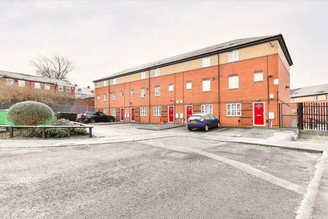 Modern red-brick terraced property with secure ...