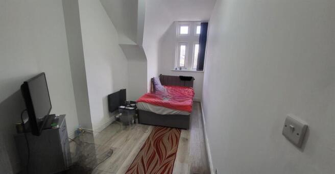 Bright bedroom with stylish wooden flooring...