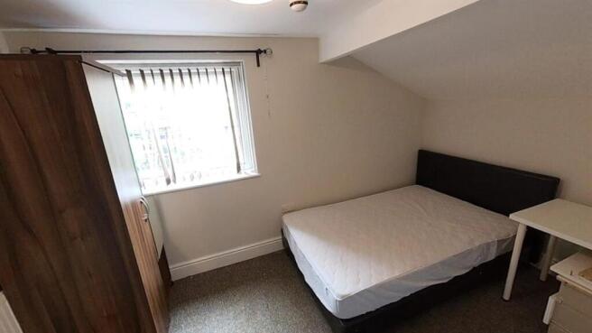 Bright attic bedroom with cozy double bed...