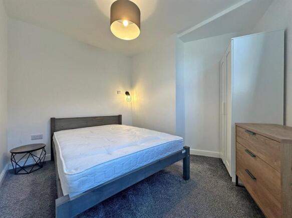 Bright modern bedroom with ample storage space...