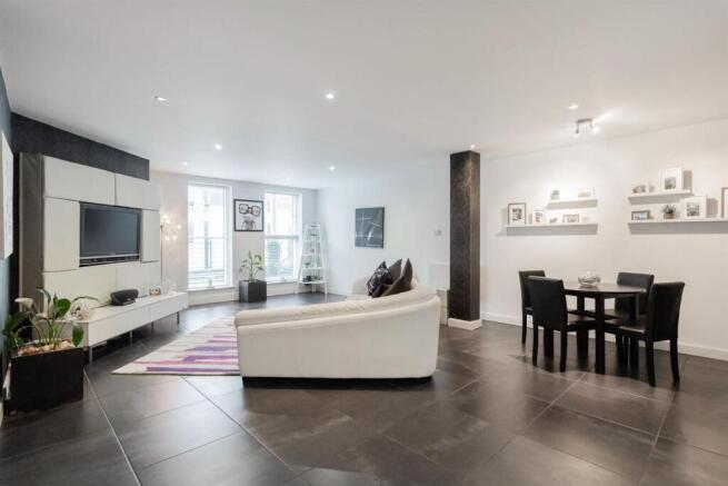 Expansive modern lounge with sleek dining area...
