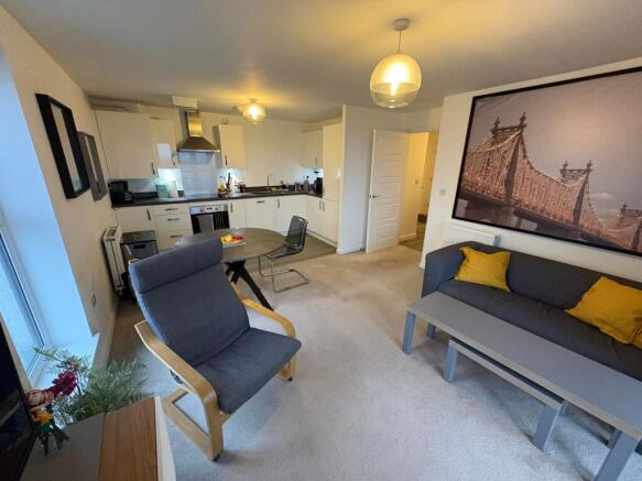Bright open-plan living area with a modern fitt...