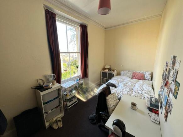 A cozy double bedroom featuring a comfortable b...