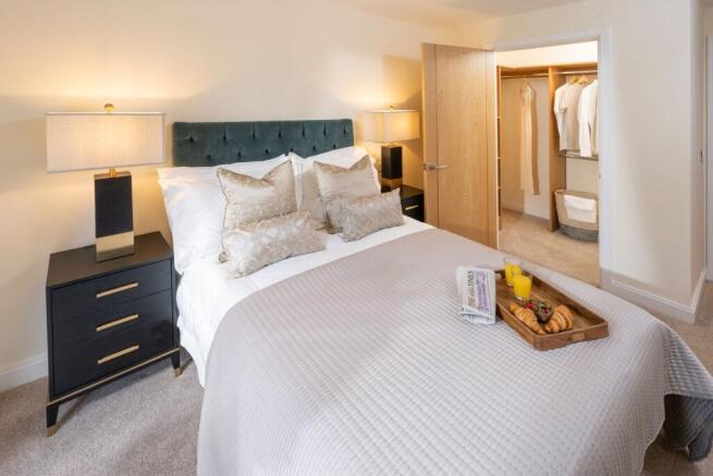 a bed with white sheets