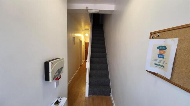 Bright, tidy entrance hallway with wooden floor...