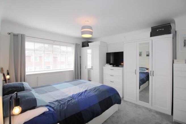 Bedroom one with wardrobes